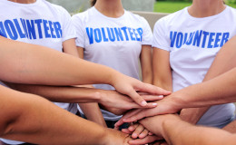 volunteer group hands together